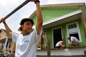Singer and band leader Fredy Omar works on the new home he is buying in the Musicians Village in New Orleans AP photos